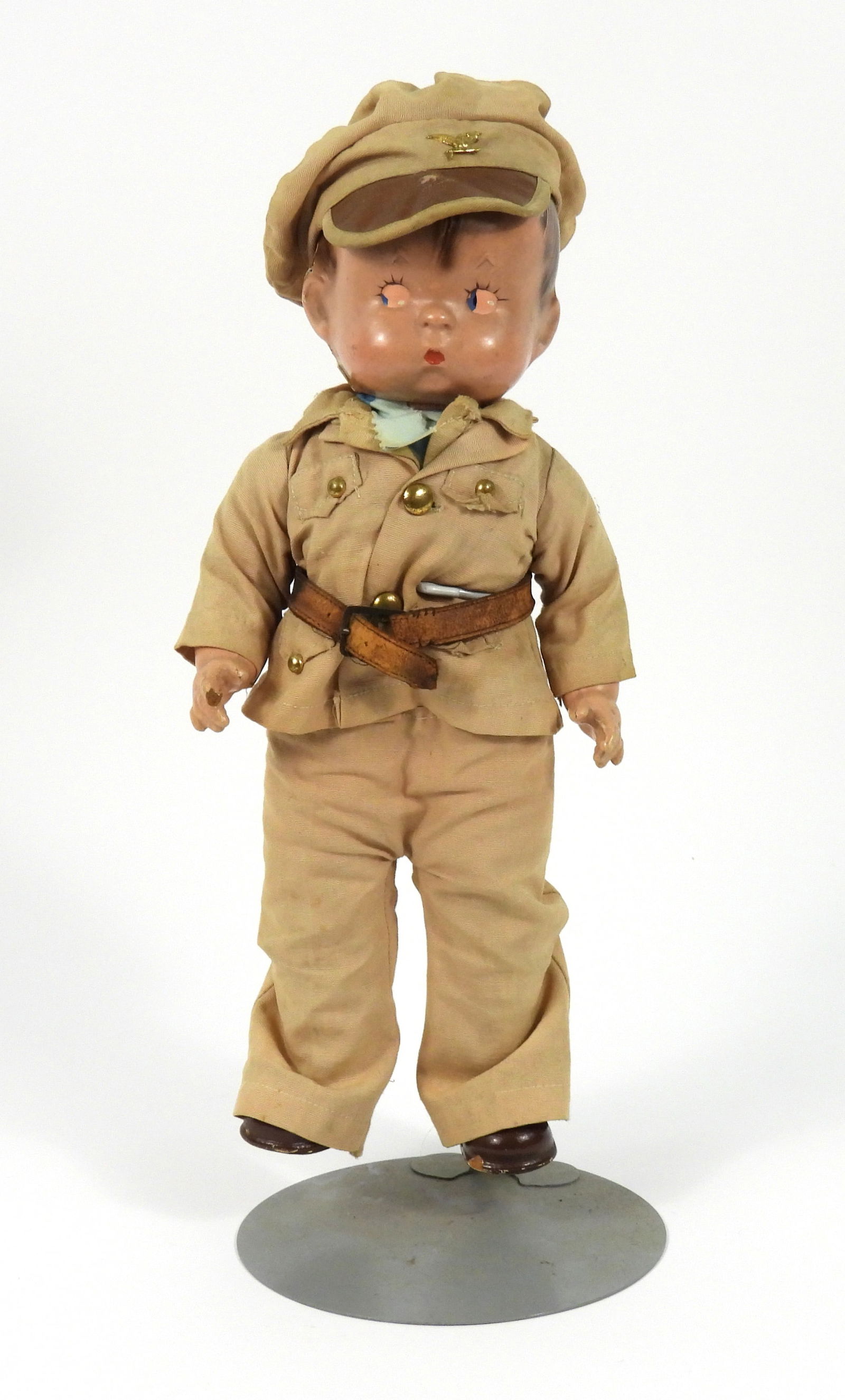 Effanbee Skippy Soldier Doll: United States, 20th Century, Composite, textile. Brunette Skippy doll with remnants of blue painted eyes dressed in a WWII style uniform. Approx. 14" tall