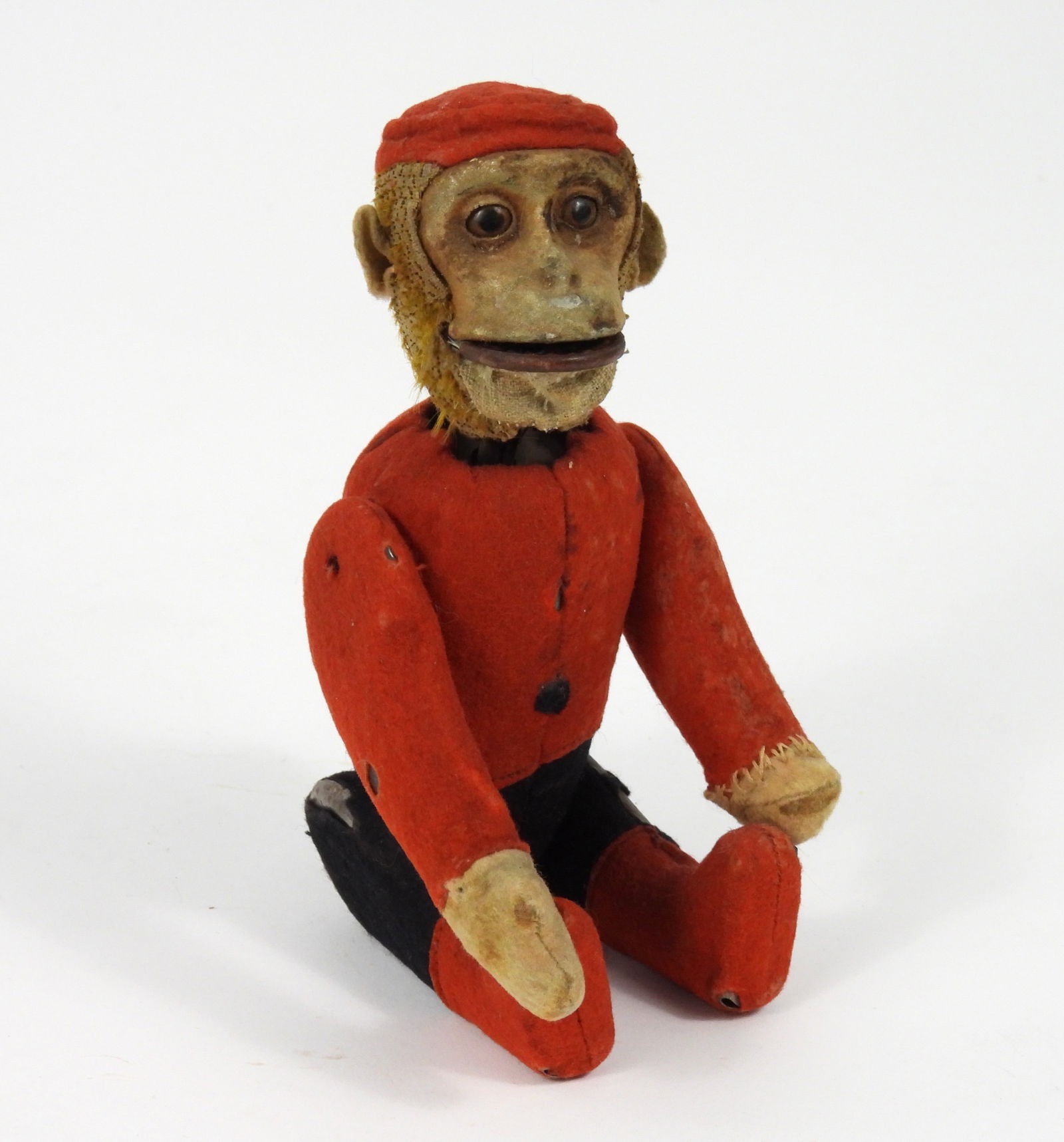 1920s Schuco Germany Mechanical Bellhop Monkey: Germany, Circa 1920's, Metal, textile. Mechanical Yes/No bellhop monkey with fabric covered metal body manufactured by Schuco toys. Approx. 8 1/2" t x 3" w x 2 1/2" d