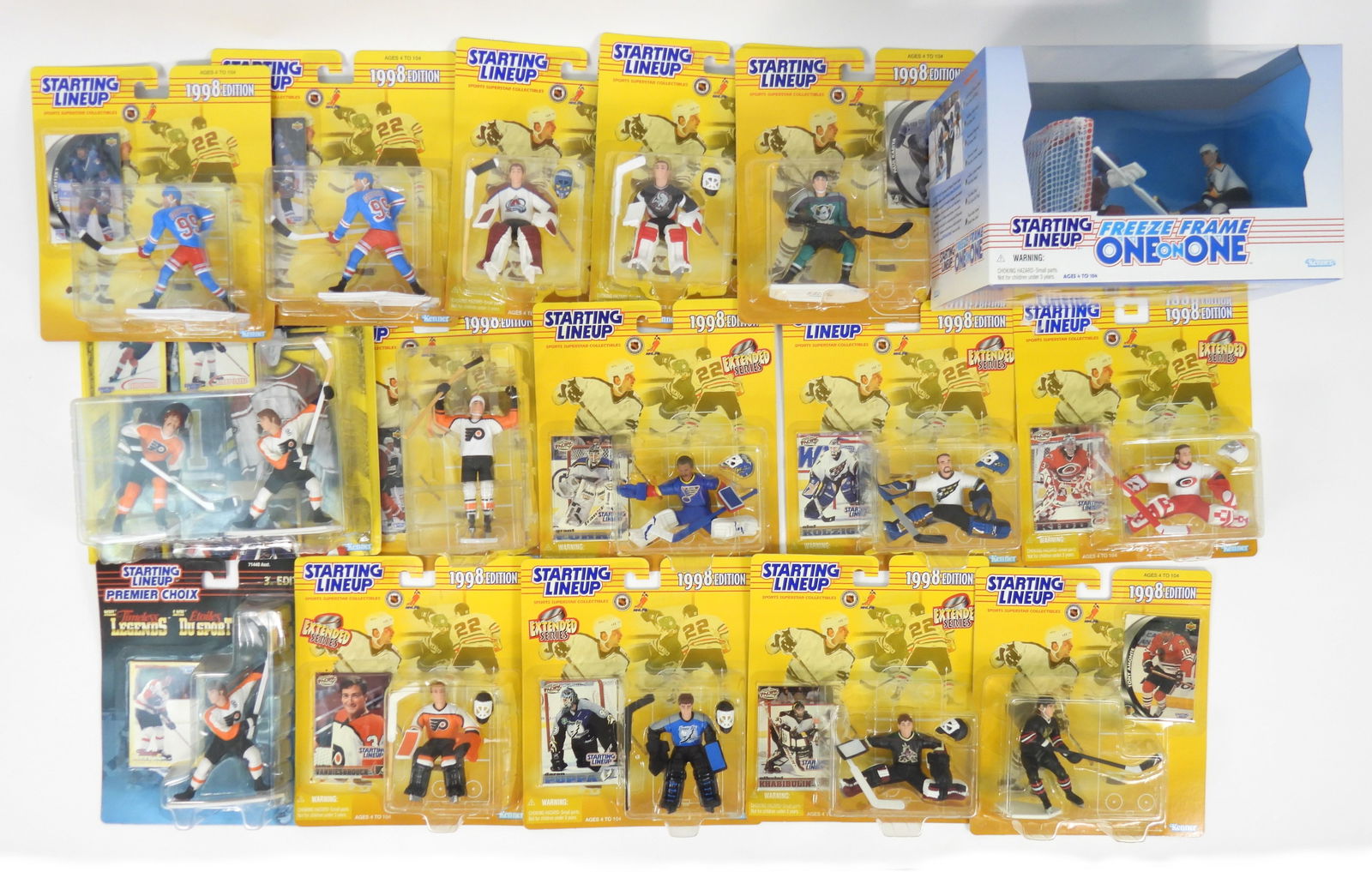 16PC Kenner Starting Lineup Hockey Figures: United States, Plastic. Includes an assortment hockey figures including Nikolai Khabibulin, Bobby Clarke, Grant Fuhr, Patrick Roy, and Dominik Hasek amongst others. Smallest 9" t x 8" w x 2" d,