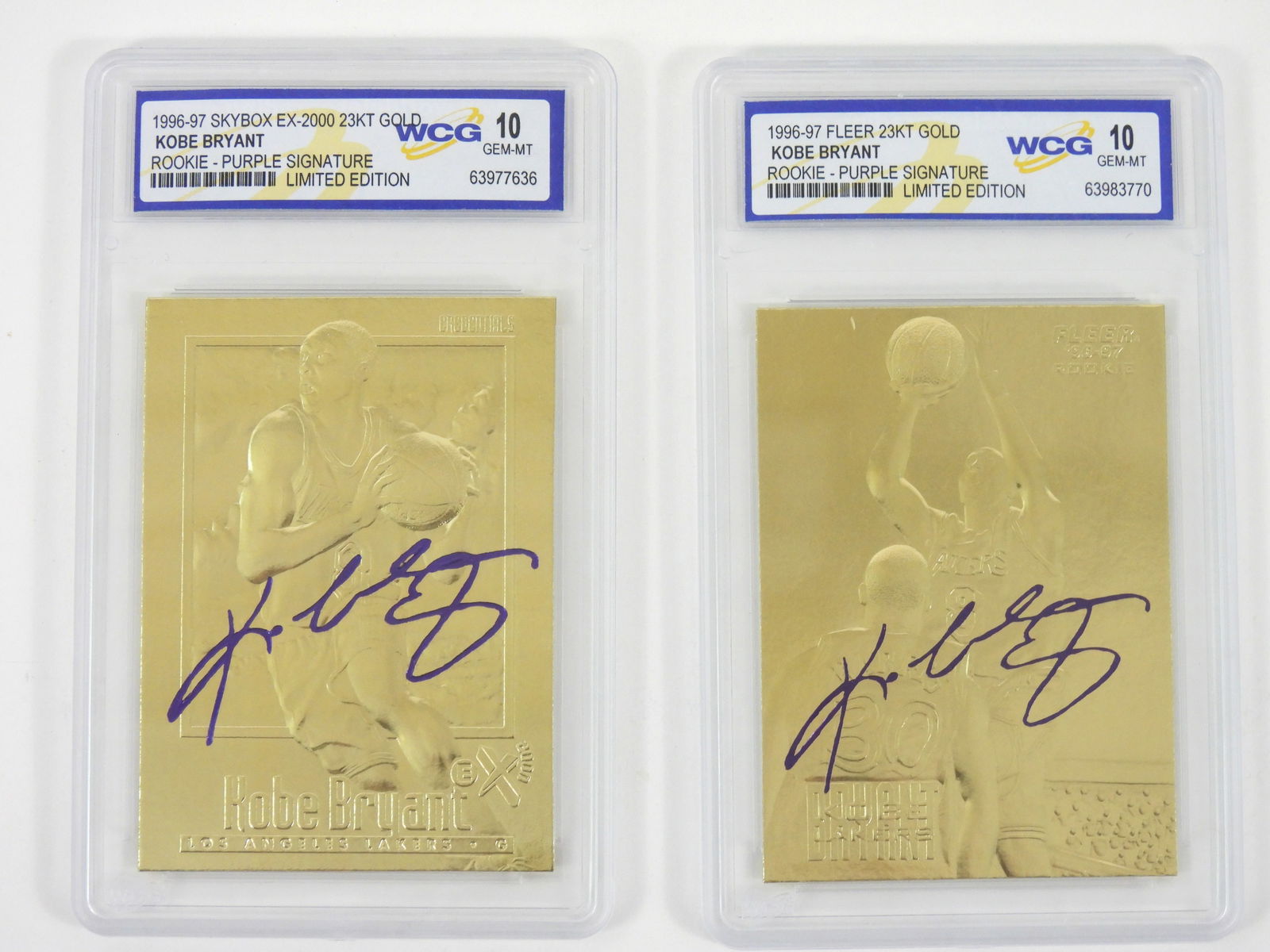 2PC Fleer & Skybox Kobe Bryant WCG Graded Cards: Includes 1996-97 Skybox Ex-2000 23KT Gold Kobe Bryant Rookie-Purple Signature Limited Edition WCG Gem MT 10, and a 1996-97 Fleer 23KT Gold Kobe Bryant Rookie Purple Signature Limited Edition WCG Gem