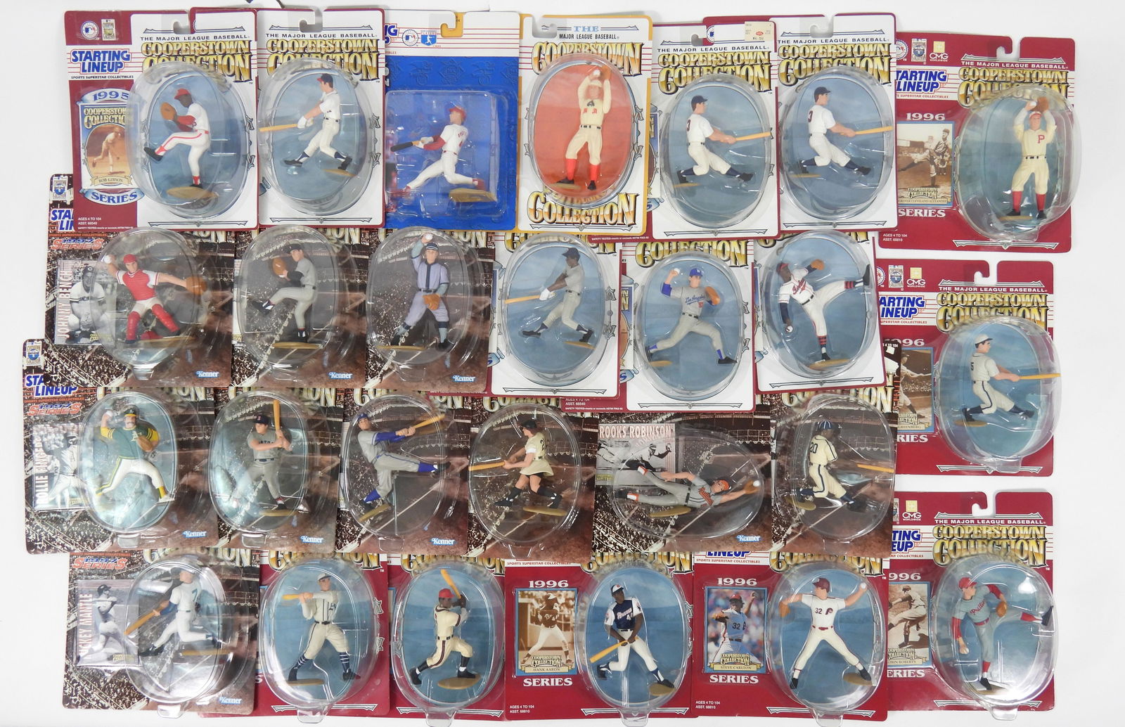 24PC Kenner Starting Lineup Baseball Figures: Twenty four Starting Lineup baseball figures including Hank Aaron, Jackie Robinson, Jimmie Foxx, Steve Carlton, Mickey Mantle, and Brooks Robinson amongst others. Each 9" t x 8" w x 2" d