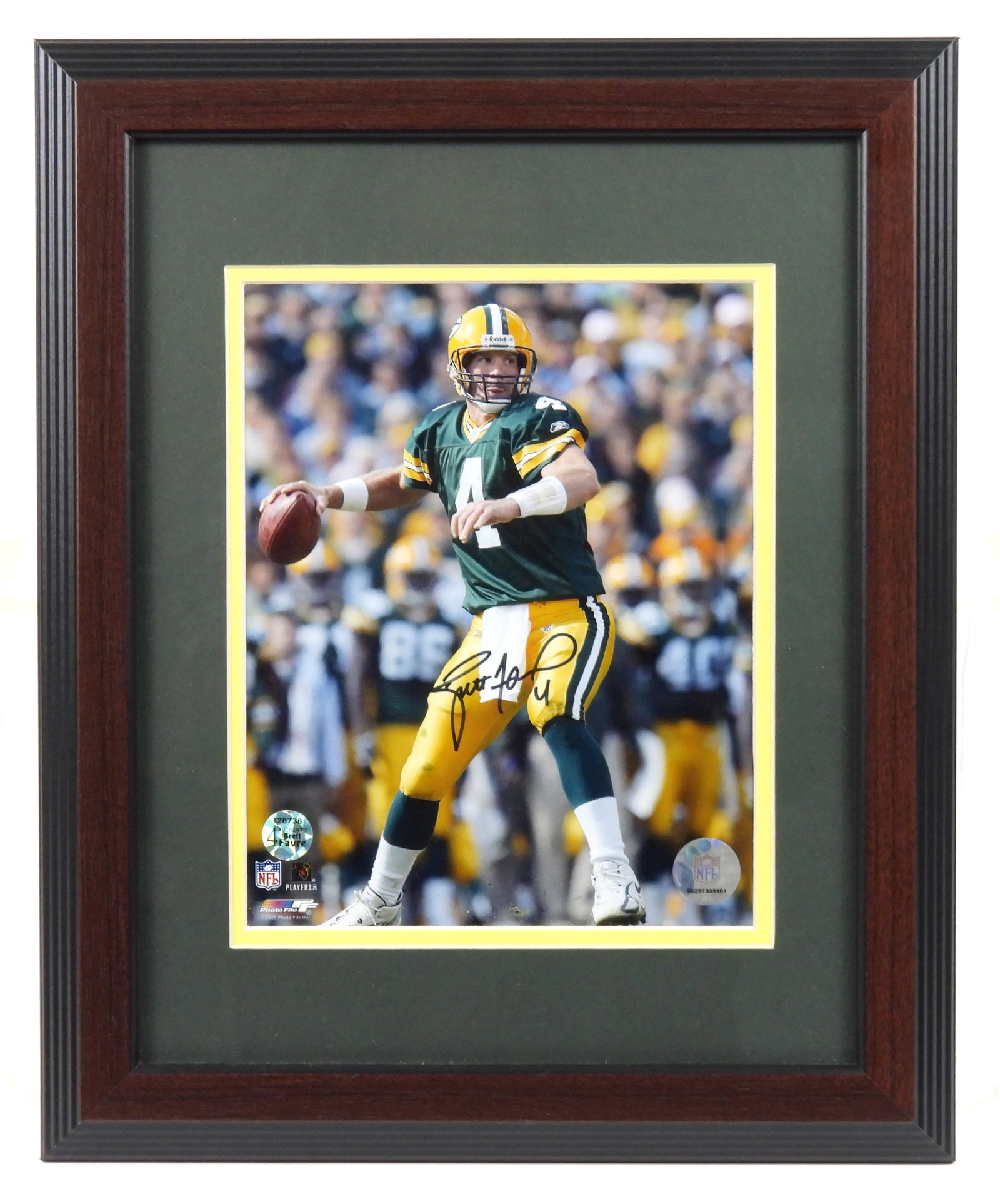 NFL Brett Favre Signed Photograph Framed: Framed 8" x 10" under glass photograph of Green Bay Packers Hall Of Fame Quarterback Brett Favre with BF company hologram COA registration number 126738 and a photo of him holding this signed photogra