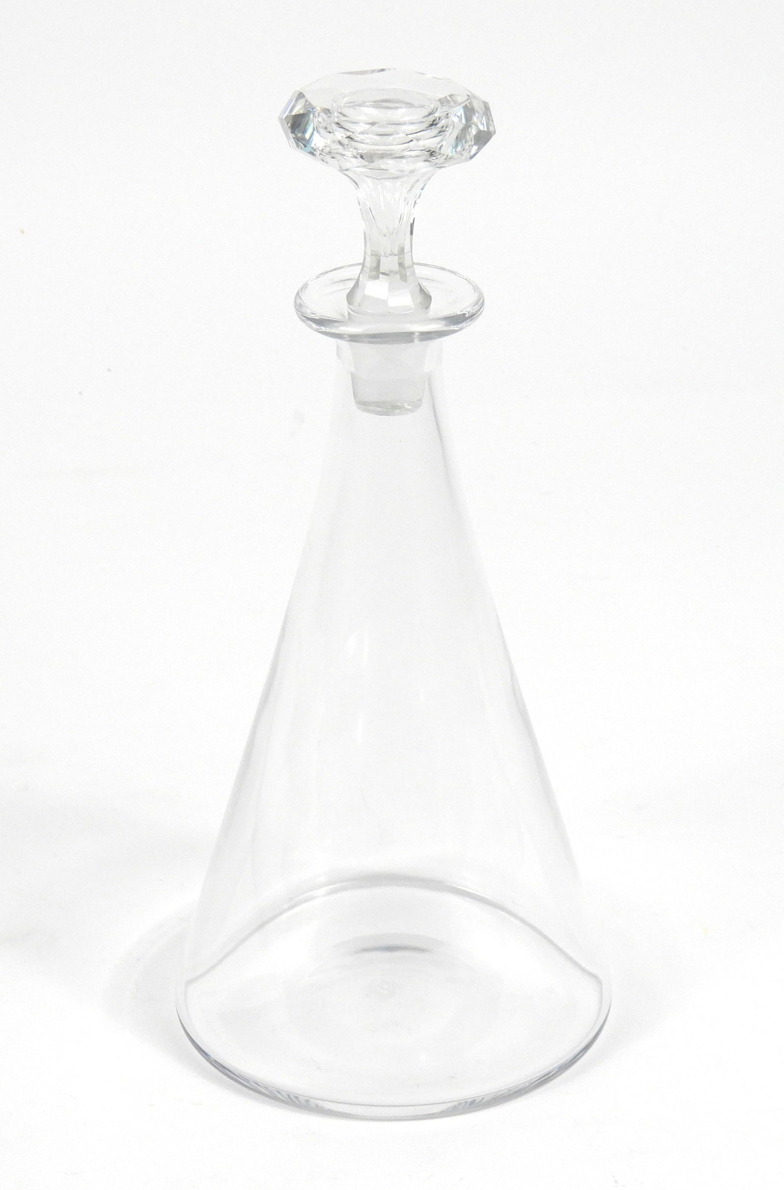 Baccarat Crystal Decanter: France, Mid 20th Century, Glass. Clear glass tapered decanter with round faceted cut crystal stopper. Approx. 11 1/2" x 5 1/8" dia.