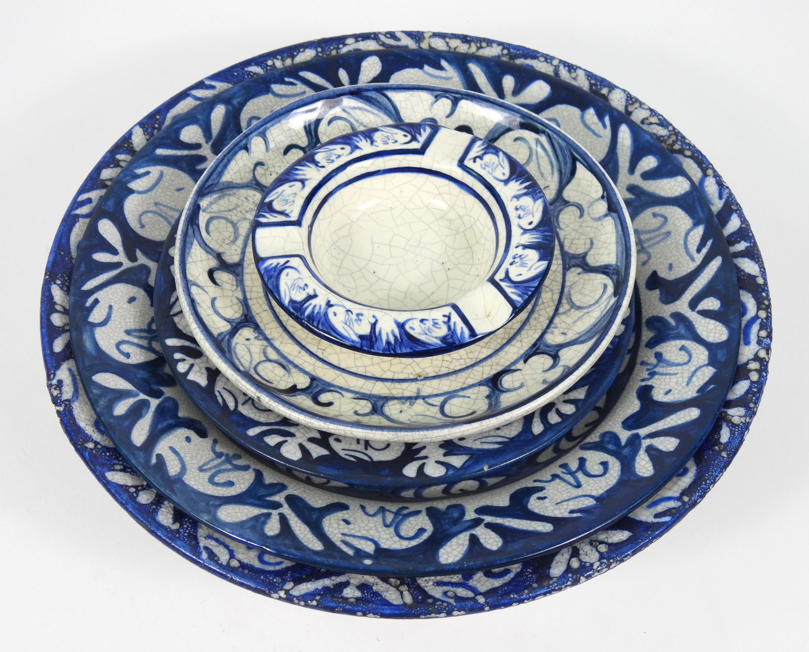 5PC Dedham Rabbit Crackle Glaze Stoneware Plates: Massachusetts, Early 20th Century, Stoneware. Includes a 3 3/4" dia. ashtray, a 6" dia. plate, a 5 3/4" dia deep dish, an 8 1/2" dia. plate, and a 9 3/4" dia. bowl.