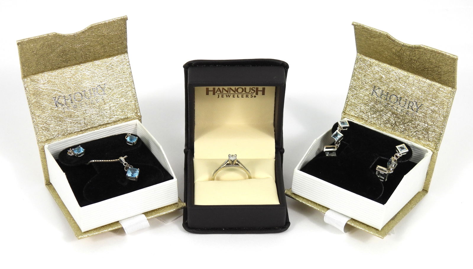 4PC Estate Sterling Silver & Topaz Jewelry: Sterling silver, topaz. Includes a sterling silver necklace with kite set cushion cut blue topaz pendant, a size 8.5 14K white gold plated ring with a brilliant cut diamond center stone, a pair of