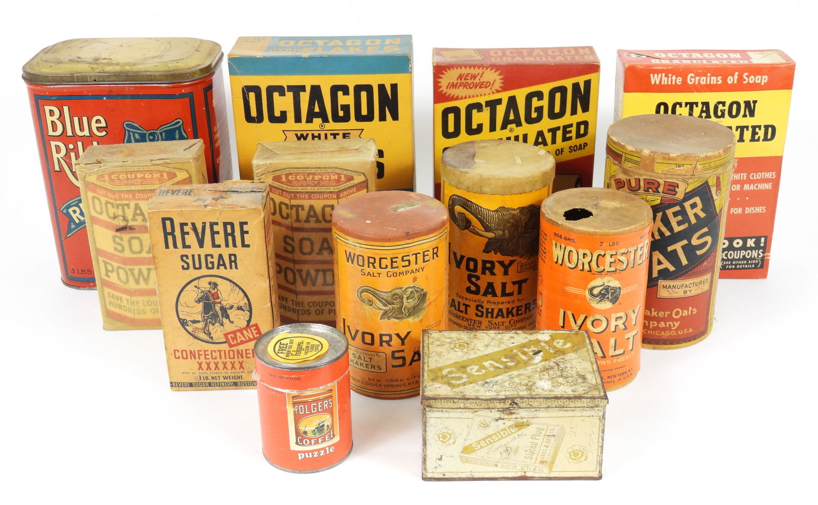 13PC Assorted Vintage Kitchen Goods Packaging: Mid 20th Century, Cardboard, tin. Includes two boxes Octagon Granulated soap, a box of Octagon White Flakes soap, two boxes Octagon soap powder, a large tin of Blue Ribbon Red Label Tea, three