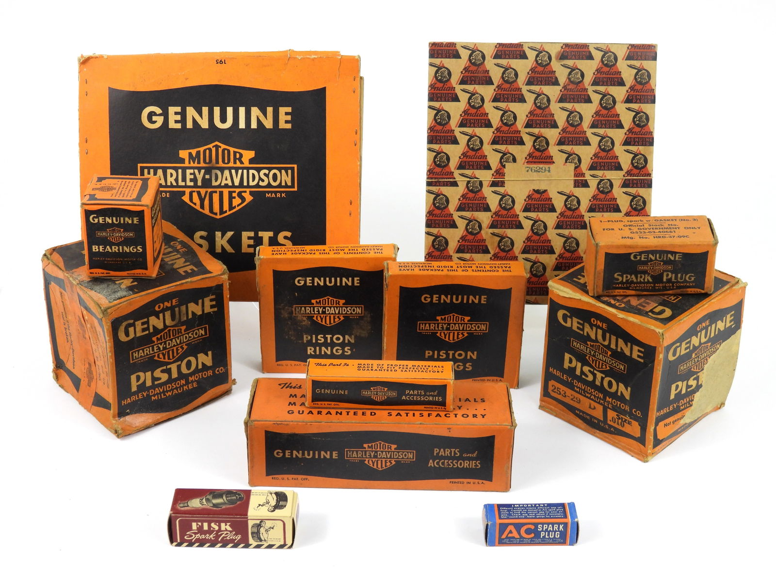 12PC Harley Davidson & Other Parts & Boxes: 20th Century. Includes a Fisk C-5 14mm spark plug in box, an unopened Harley Davidson 309-29MA bearings, a Harley Davidson spark plug box, a Harley Davidson 275-32C piston pin in box, an AC 103