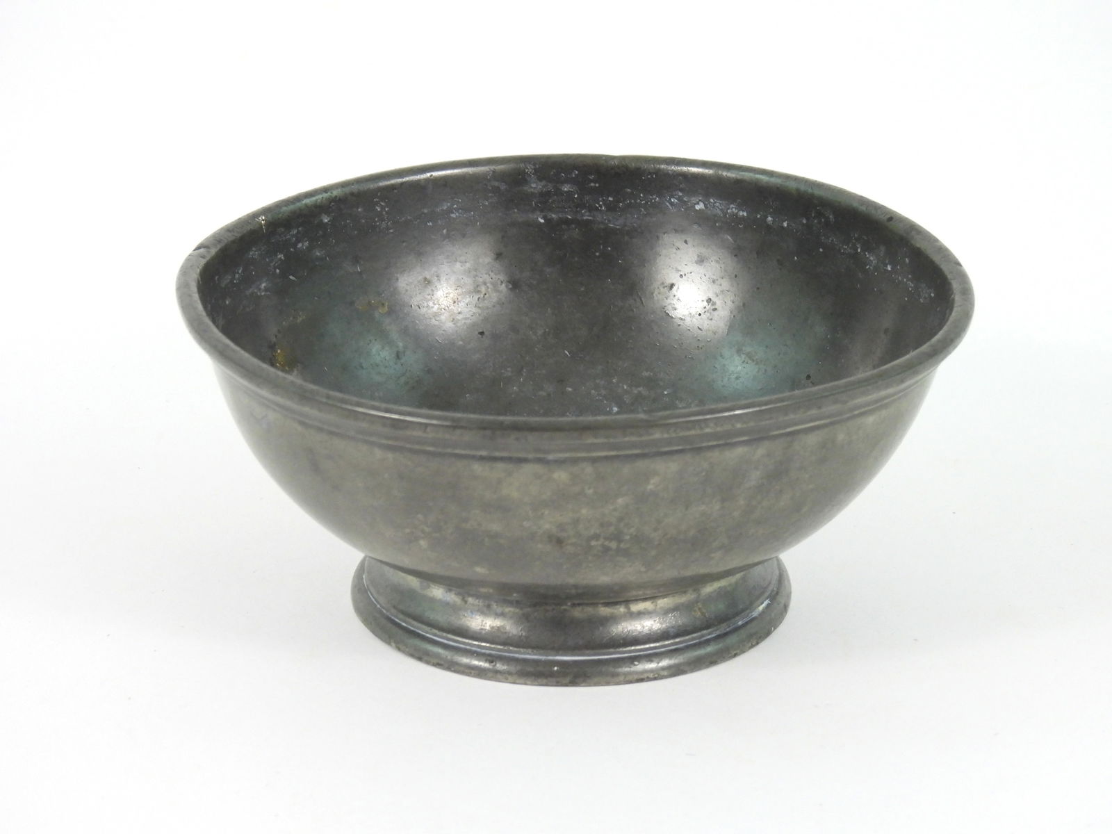 18C Pewter Bowl From the H.M.S. Hawk: 18th-19th Century, Pewter. Deep footed bowl stamped at bottom "H M S HAWK" No visible maker marks present. There were several English Naval warships named the Hawk during the 18th and early 19th