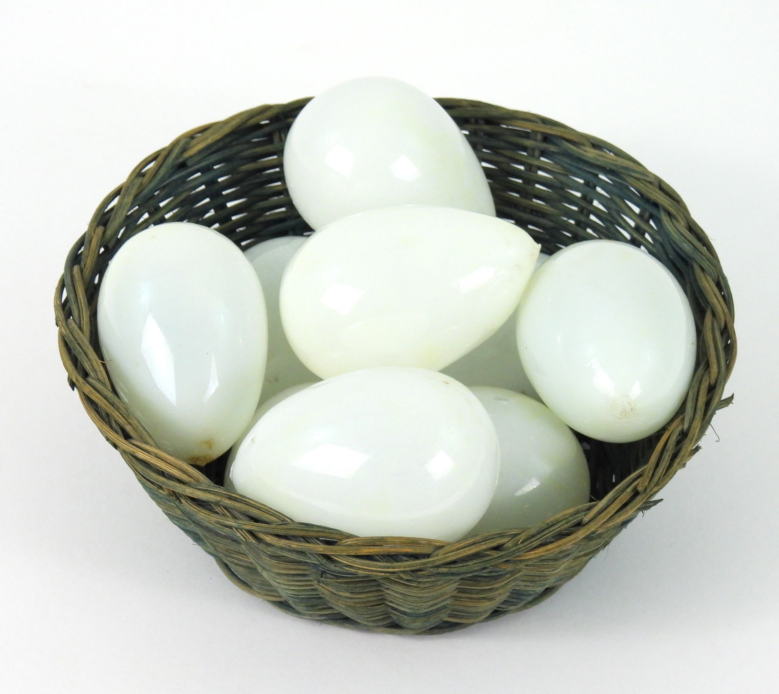 10PC Basket & Milk Glass Eggs: Includes nine blown milk glass eggs nestled in a blue basket bowl. Eggs approx. 2 1/2" x 1 1/2" dia., Basket 2 1/2" x 6 3/4" dia.