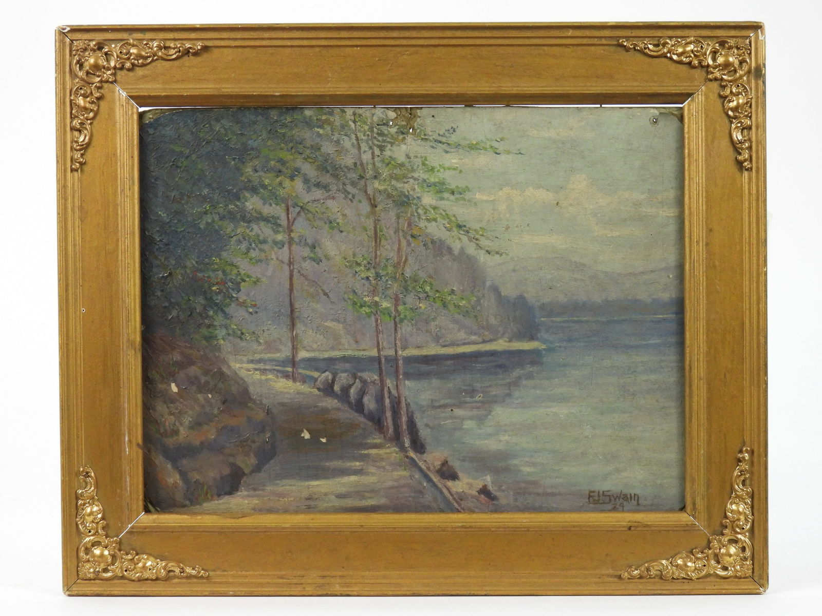F.J. Swain Lake Trail Landscape Painting: F.J.Swain, United States, 20th Century, Oil on board. Impressionist depiction of a tree lined walking trail beside a lake. Board 9" x 12", Frame 12 1/2" x 15 1/4"