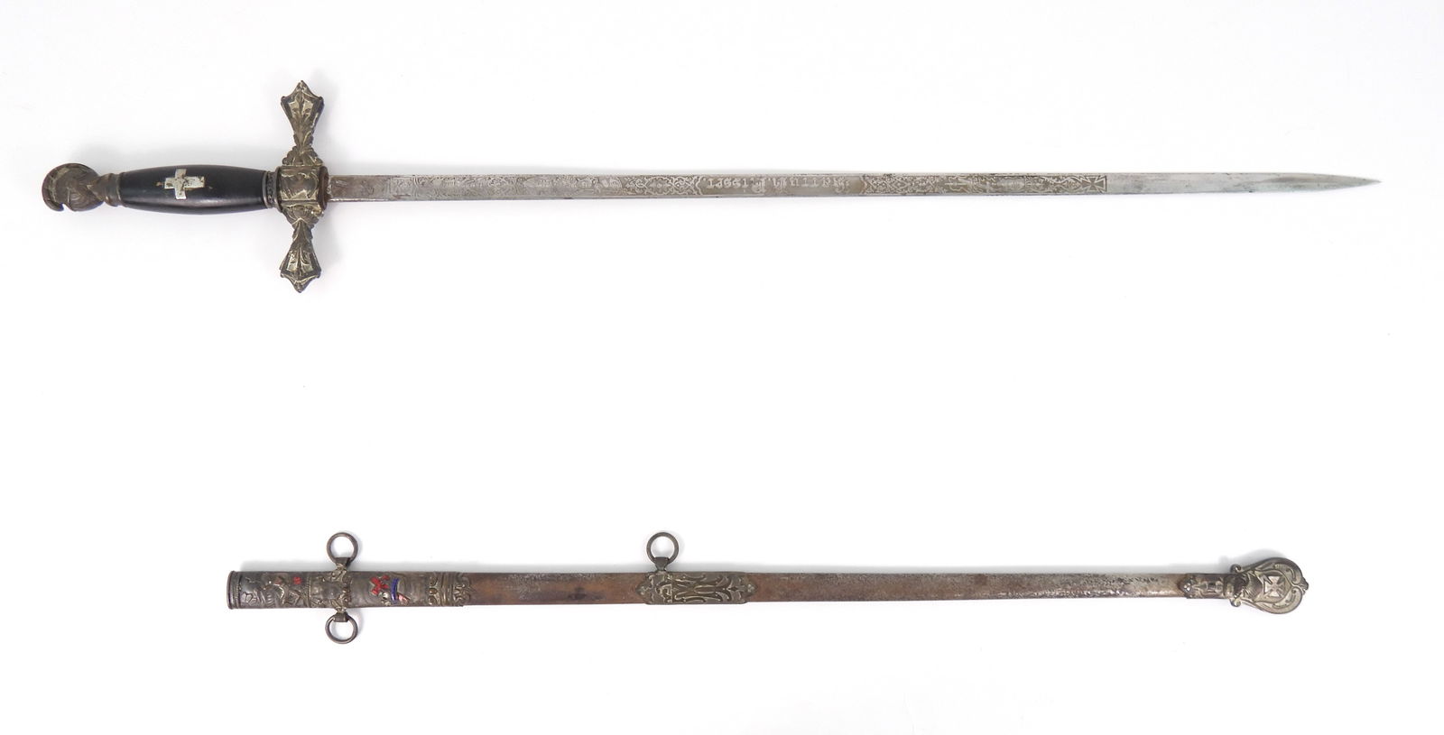 I'D Masonic Fraternal Sword w/ Scabbard: 19th century knights head pommel sword with ornate knights templar etched blade, I'D to Larry R. Risser. Marked "Mculley & Co Columbus Ohio"