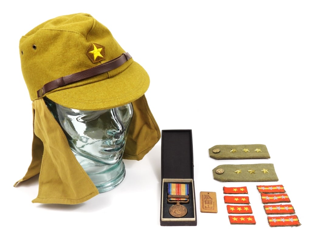 WWII Imperial Japanese Insignia and Cap: Reproduction Japanese wool cap; four sets of original collar insignia; a pair of original epaulets; a wooden tag with Japanese characters; and a boxed China Incident Medal.