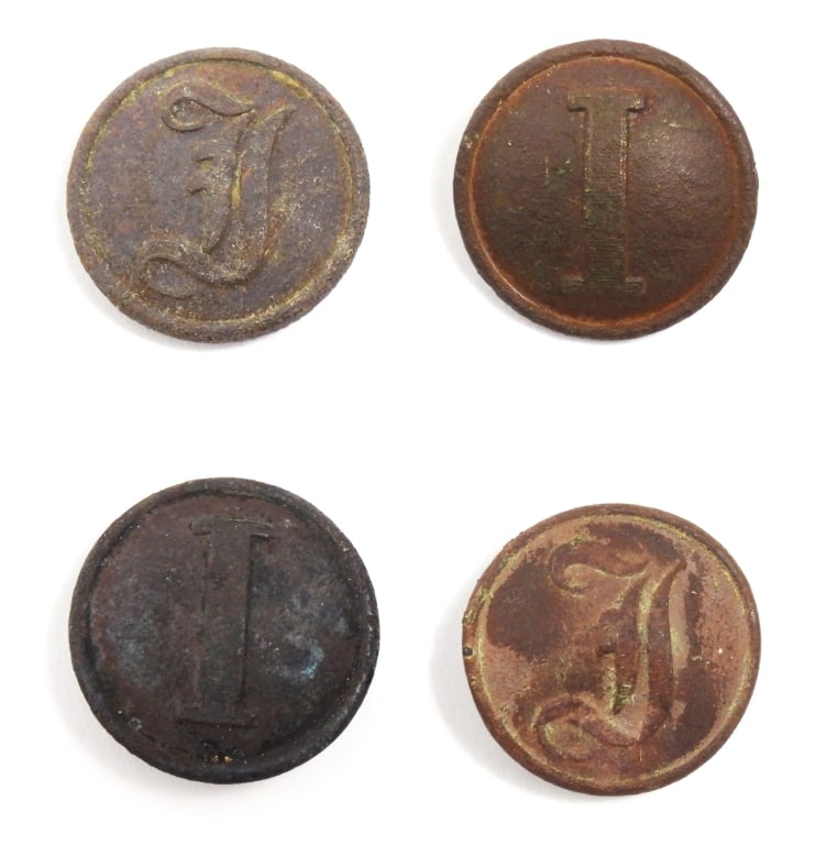 Four Confederate Infantry Buttons: Two block "I" buttons with shanks still attached and no visible back mark (22.6mm); and two script "I" buttons with bent shanks and one marked "S ISAACS CAMPBELL/LONDON" on the back.