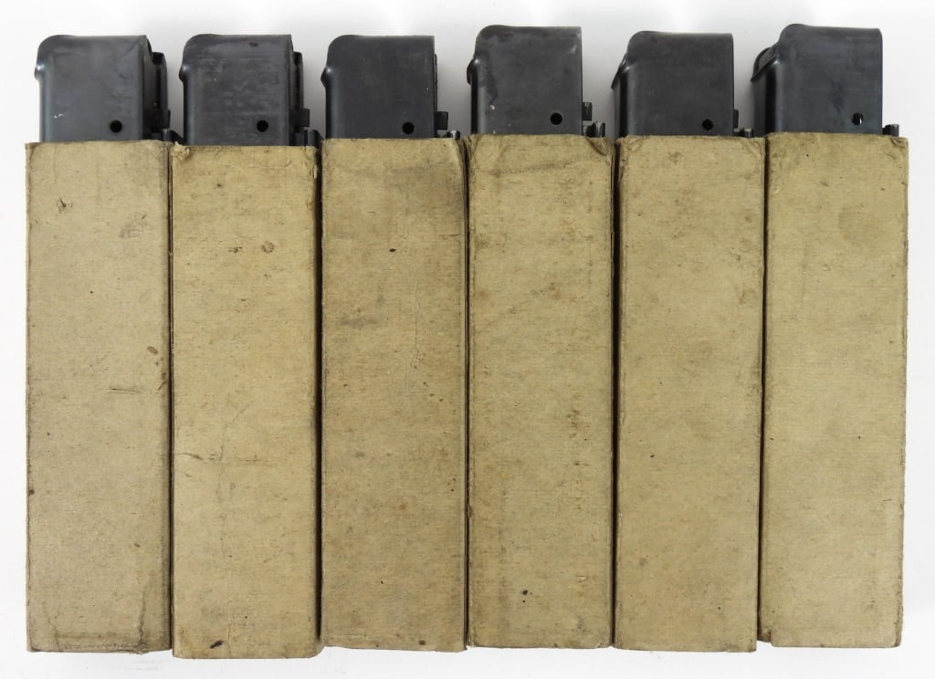 Six Seymour Products Thompson SMG Magazines: Six Thompson SMG 20 round magazines in pasteboard sleeves, all marked "THE SEYMOUR PRODUCTS CO/SEYMOUR, CONN".Disclaimer and lot information: Many states restrict or prohibit magazines that hold more