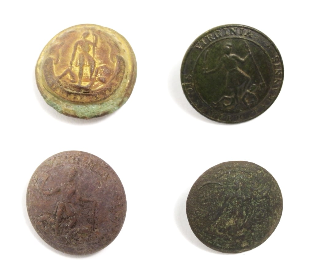 Four Dug Virginia Buttons: A one-piece coat-size Virginia button with an intact shank and "YOUNG SMITH & Co/NEW YORK" back mark (22.6mm); a one-piece coat-size Virginia button (worn face) with an intact shank and a worn back ma