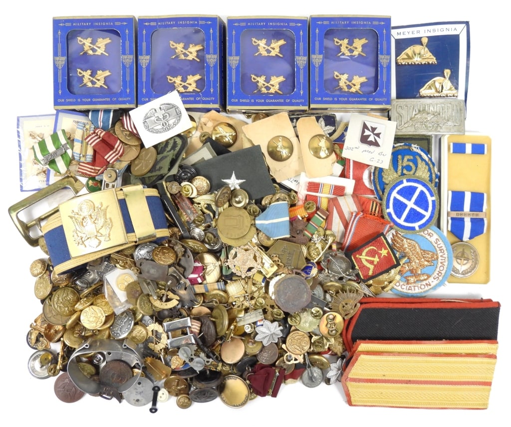 Large Group of US Military Insignia: Large group of medals, pins, patches, two pairs of Russian shoulder boards, dog tags, a belt, and other miscellaneous insignia.