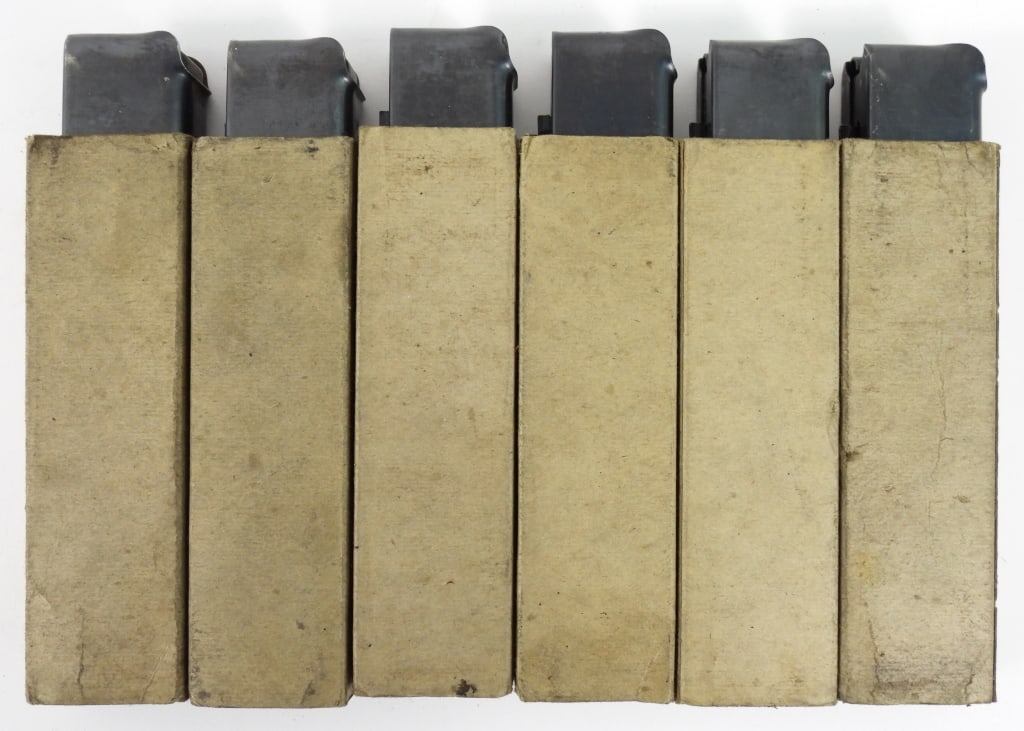 Six Seymour Products Thompson SMG Magazines: Six Thompson SMG 20 round magazines in pasteboard sleeves, all marked "THE SEYMOUR PRODUCTS CO/SEYMOUR, CONN".Disclaimer and lot information: Many states restrict or prohibit magazines that hold more