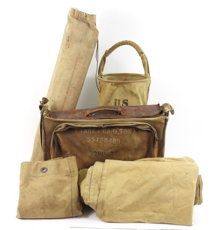 Group of Military Items: A 1918-dated collapsible water bucket with an added iron frame; a duffle bag; a canvas map bag with maps; a suitcase; and two khaki WWI U.S. Marine Corps ground cloths.