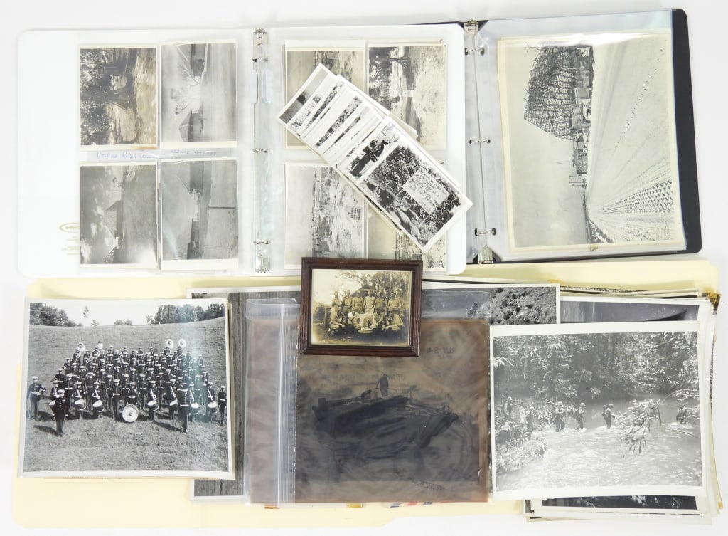Group of WWII USN & USMC Photographs & Negatives: A binder with 26 images of Namur including aerial photographs of the island and a negative of a map of the Marshall Islands; An image of a group of Marines with Ernie Pyle and a Japanese flag marked