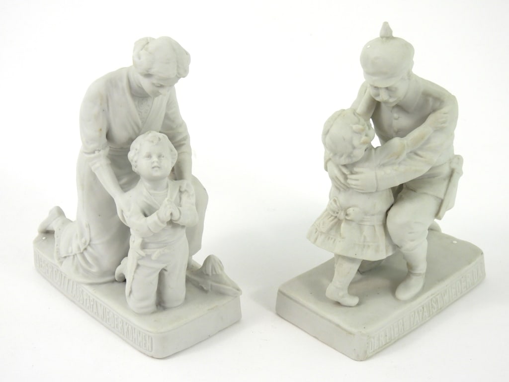 Two WWI German Porcelain Figures: A daughter welcoming home her father in military uniform; and a mother with her son praying for the safe return of his father with a short sword on his side.