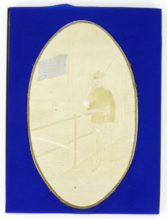 Embossed Image of an Infantryman: An image of an infantryman on guard carrying a rifle, wearing a tunic with shoulder cords, a bayonet, corporal stripes, and a visor cap with crossed rifles on the front, a silvered American Flag,