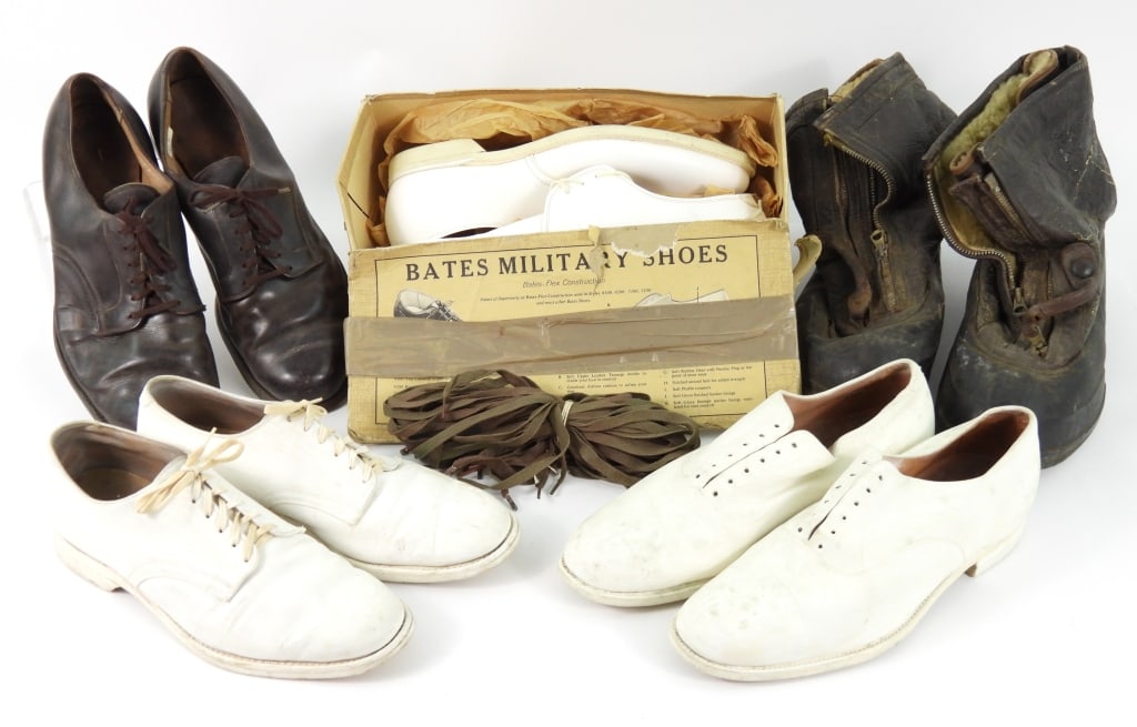 Group of Military Footwear: A pair of U.S. Navy flight boots with a brown leather upper; a pair of Bates U.S.M.C. white dress shoes unworn in the pasteboard box; a pair of brown leather dress shoes; a pair of Stetson white
