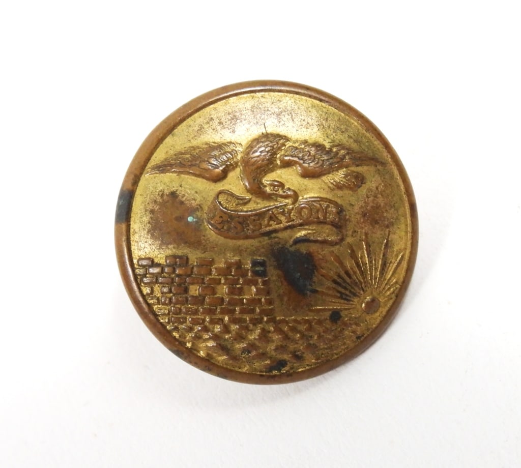 US Engineer Corps Button: A three-piece coat-size Engineer Corps button marked "SCOVILL MF'G CO/WATURBURY" on the back.