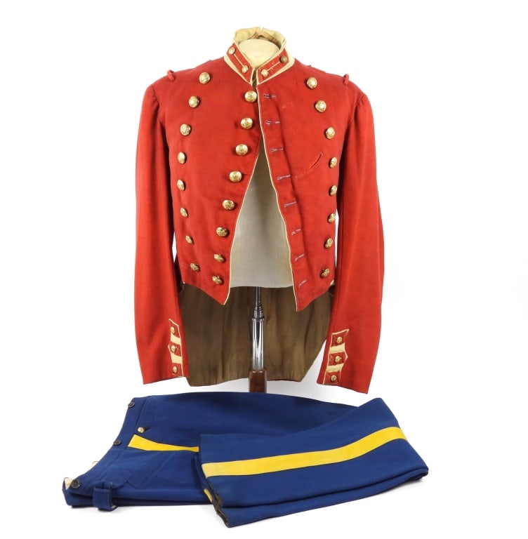 Militia Cavalry Coatee and Trousers: Red broadcloth body with buff collar, false cuffs, pocket flaps, and turnbacks, gilt-brass eagle "C" buttons with "TREBLE/GILT" and "D. EVANS & CO./ATTLEBORO MASS" buttons, loops on the shoulder for
