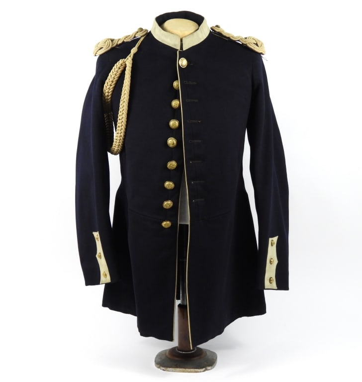 Connecticut Model 1885 Uniform Coat: Blue wool broadcloth body with piecing on the buttonhole side of the forepart, white false cuffs, collar, and trim on the back false pockets, brass Connecticut state buttons with "JOHN F. BOYLAN,