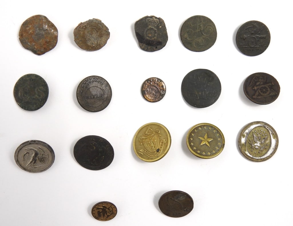 Group of Military Buttons: A coat-size dug pewter British button with a crown over a rose (some loss) marked "FIRMIN" on the back; a coat-size brass button with three feathers over "ICH DIEN" in a banner and "DG" with a bent
