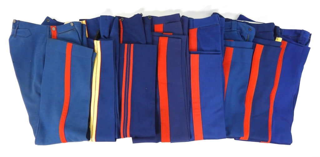 Eight Pairs of Blue USMC Trousers: Seven pairs of USMC trousers, and one pair of enlisted trousers marked "Quartermaster's Department/U.S. Marine Corps,/1915-16/6-M".