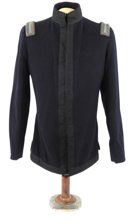 Lieutenant's Model 1895 Undress Tunic: Dark blue broadcloth body, black mohair tape on the fronts, bottom, and around the collar, 2nd lieutenant's shoulder boards, a black lining, marked on the tag inside the pocket "2nd Lt. Wm. J. Puller