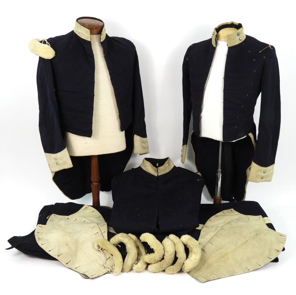 Group of Richmond Light Infantry Blues Uniforms: Two pairs of blue wool R.L.I.B. breeches with a white stripe on the outseams; three pairs of R.L.I.B. blue wool trousers with a white stripe on the outseams; four bob fronts for coatees; seven white w