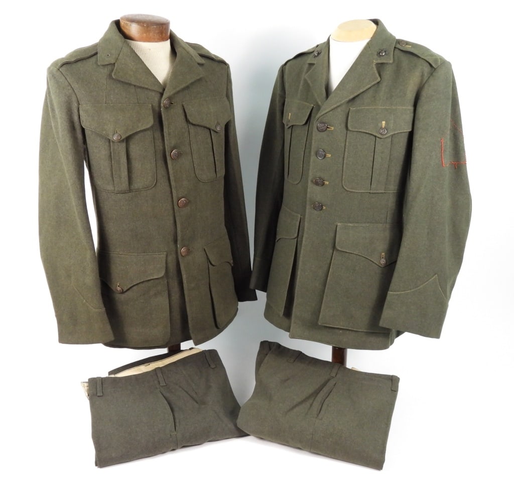 Two US Marine Corps Uniforms: A green tunic with US Marine Corps buttons, marked "5L/Quartermaster's Dept./U.S. Marine Corps/1922-23." in the left sleeve lining, a pair of trousers marked "6M" on the waistband lining; and a green