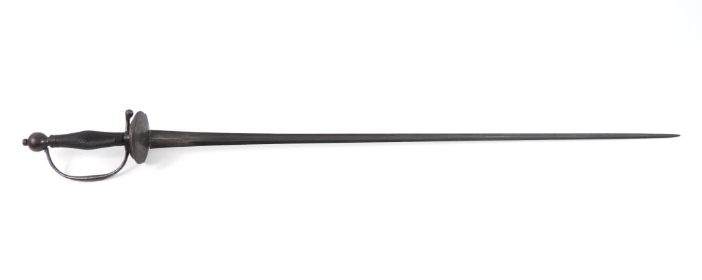 Rare French 1750s Sergeant's Sword: Iron hilt and counter-guard with a reeded ebony grip, steel triangular blade, and a collection number on the back of the blade marked "F-G-46". Note: For a similar example from Don Troiani's collectio