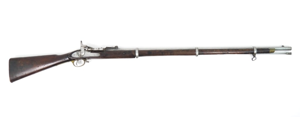British Pattern 1853 Snider Conversion: .577-caliber, walnut stock with an Enfield cartouche on the right side of the butt, with a rack number on the brass butt plate tang, marked on the tail of the lock with a crown over "VR" and