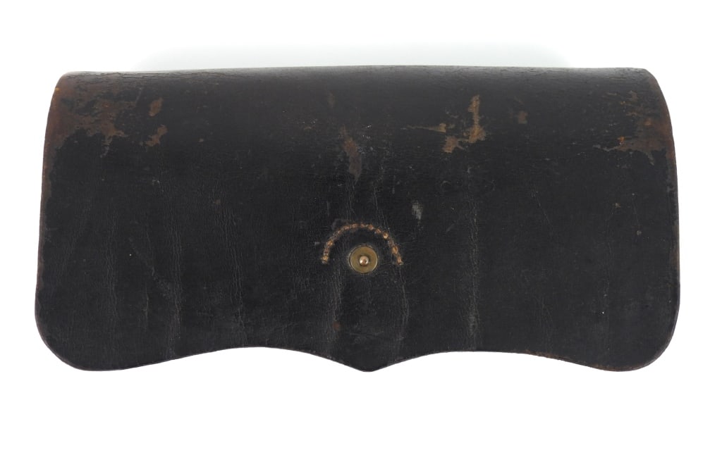 Civil War-era Burnside Cartridge Box: Black leather Burnside carbine cartridge box with the closure strap sewn and riveted, marked inside the cover "G.W.N." and "K/5th/N.Y.", inner flap marked "DINGEE & LORIGAN/MAKERS/NEW-YORK", and a twe