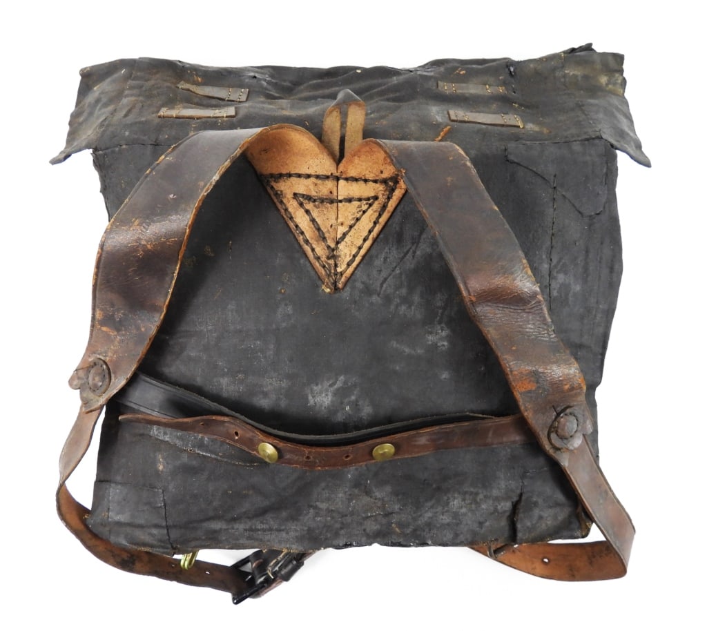 Civil War-era Double Bag Knapsack: Tarred linen canvas double bag knapsack with leather closure straps, leather shoulder straps have a makers mark and "AUG. 13, 1864". United Sates