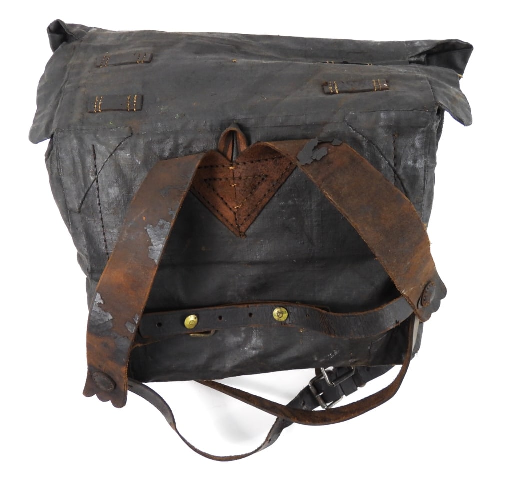 Civil War-era Double Bag Knapsack: Tarred linen canvas double bag knapsack with leather closure straps, and leather shoulder straps. United States