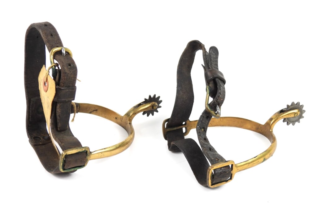 Civil War-era Spurs and Straps: Brass spurs with leather straps and and brass buckles, with a tag marked "Spurs worn by/Henry Shephard/father of Thos M. Shephard". United States