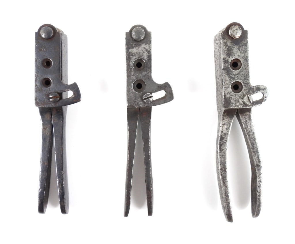 Three Colt Pistol Bullet and Ball Molds: A .44-caliber ball and conical bullet mold marked "COLT'S/PATENT"; a .36-caliber ball and conical bullet mold marked "COLT'S/PATENT"; and a .31-caliber ball and conical bullet mold marked