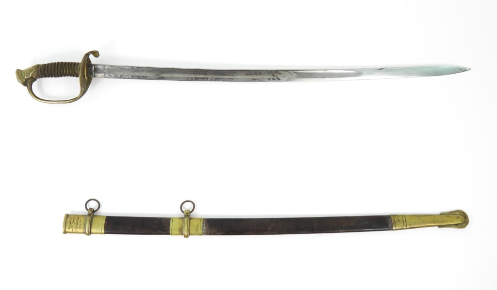 Identified Roby Model 1850 Foot Officer's Sword: Gilt brass hilt, pommel engraved with foliate designs, pierced counter-guard with foliate designs, shagreen and wire-wrapped grip, marked "IRON PROOF" on the spine of the blade, marked "C. Roby/W. Che