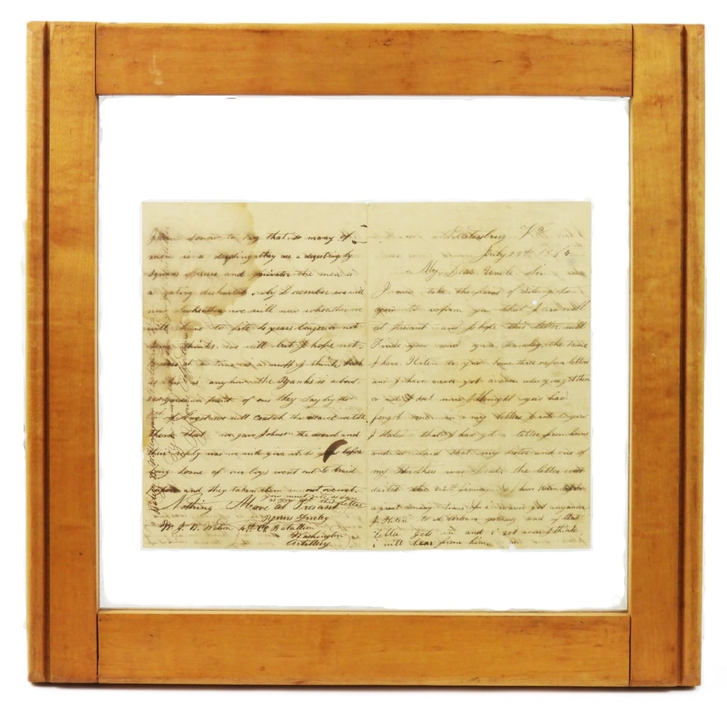 Letter from W.J.B. Watson, Washington Artillery: Framed letter in double sided glass dated July 27, 1864 from Petersburg, Virginia from W.J.B. Watson, 4th Company Washington Artillery, to his uncle back home about what's going on in the trenches,