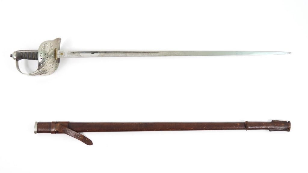 British Pattern 1897 Infantry Officer's Sword: Silver plated hilt pierced with foliate designs and "ER/VII" for King Edward (1901-1910), brass wire-wrapped shagreen grip, steel blade engraved with foliate designs and the King's cipher, marked "PRO
