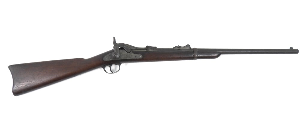 US Model 1873/79 Trapdoor Springfield Carbine: .45-70-caliber, serial number 142858, walnut stock with no visible cartouche marks, "U" stamp below the trigger guard tang, steel fittings, lock marked with an eagle and "U.S./SPRINGFIELD", and the