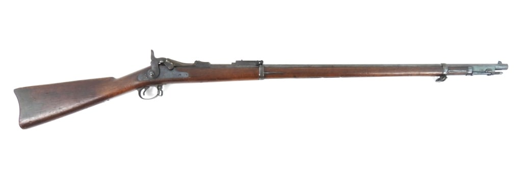 US Model 1884 Trapdoor Springfield Rifle: .45-70-caliber, serial number 517011, walnut stock with a crisp cartouche on the left side, steel fittings, lock marked with an eagle and "U.S./SPRINGFIELD", breech block marked "U.S./MODEL/1884",