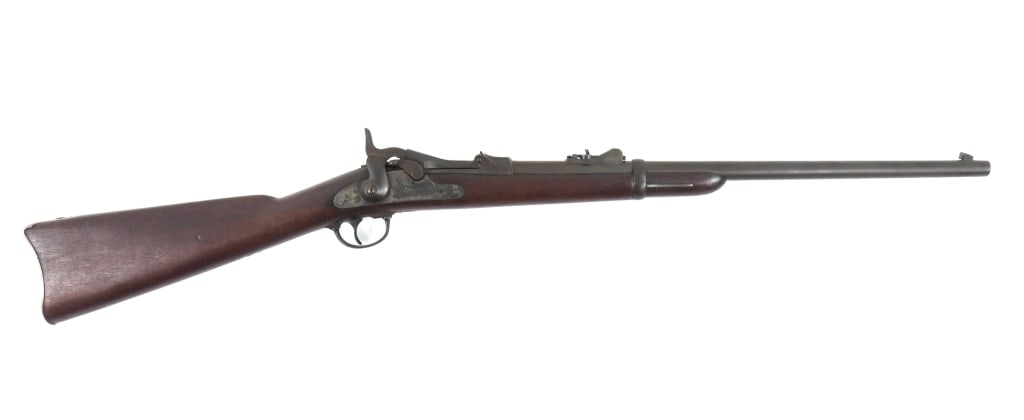US Model 1873 Trapdoor Springfield Carbine: .45-70-caliber, serial number 140072, walnut stock (no visible cartouche, compartment in the butt for a cleaning kit, steel fittings, with an eagle on the lock and "U.S./SPRINGFIELD", marked on the