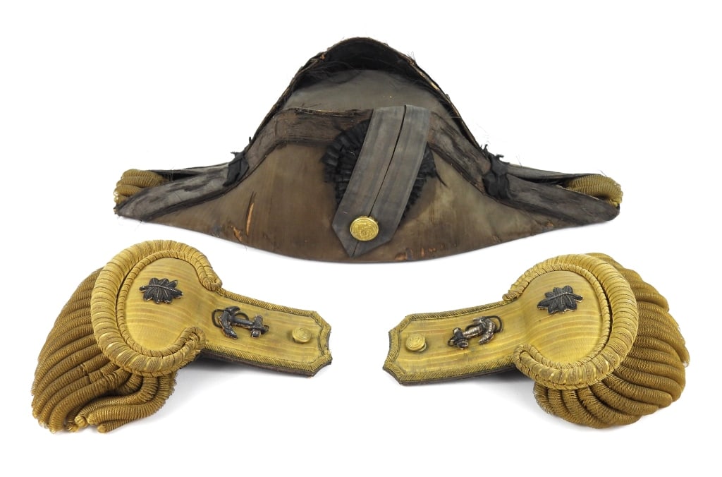 US Navy Officer's Epaulets & Bicorn: A U.S. Navy bicorn hat with a Baltimore label on the inside; a pair of U.S. Navy dress epaulets made in France. United States/France