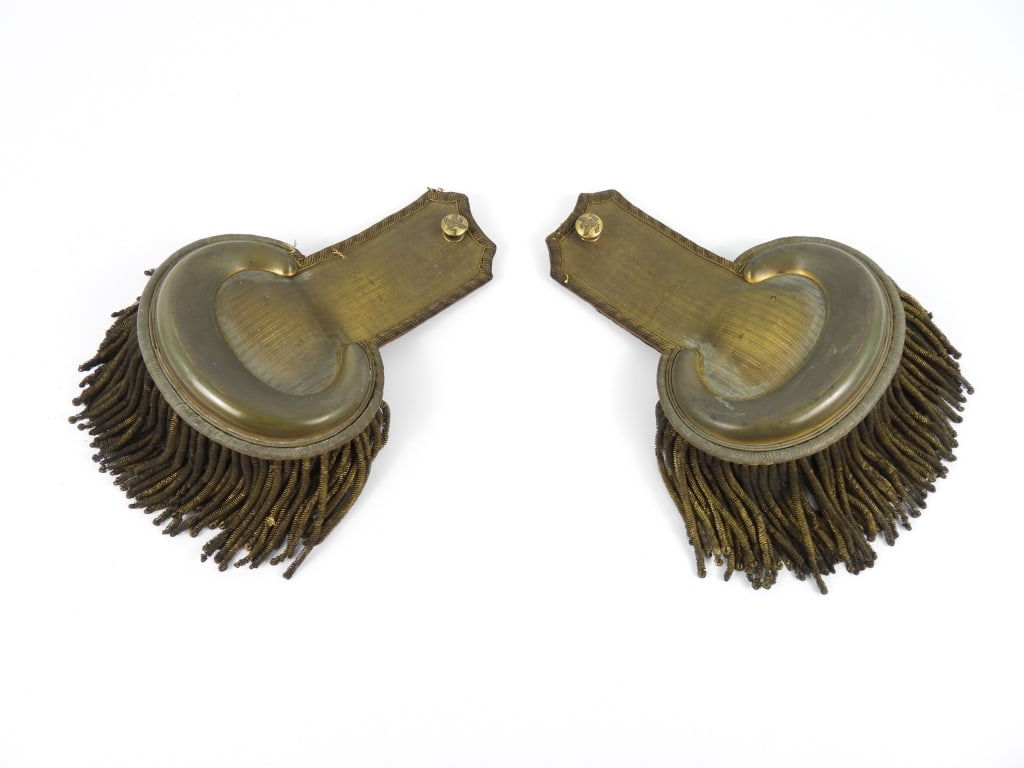 Pair of Tiffany & Co. Artillery Officer's Epaulets: A pair of gold officer's dress epaulets with embroidered edges, early eagle "A" studs, gold fringe, red Morocco leather on the underside, brass attachments marked for each shoulder and "TIFFANY &