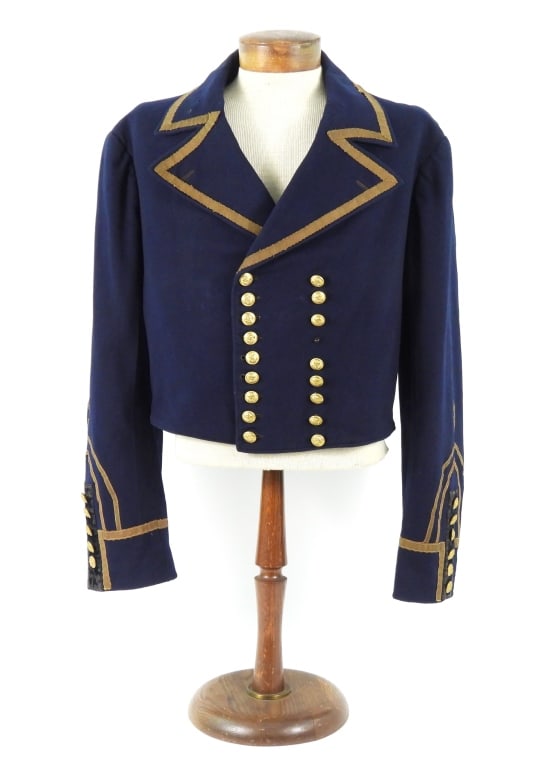 Post Civil War U.S. Navy Round Jacket: Blue superfine broadcloth body, brass anchor buttons marked "SCOVIL MFG. CO./WATERBURY" on the back, machine sewn seams, gold metallic tape hand-sewn on the collar and lapels, corded keyhole